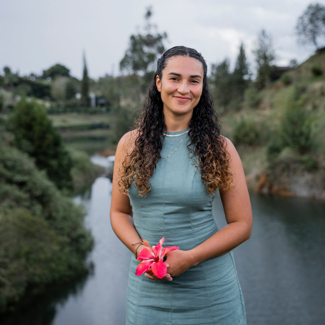 daniella with a flower headshot
